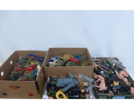 Four boxes of Action Man figures, accessories and clothing.
