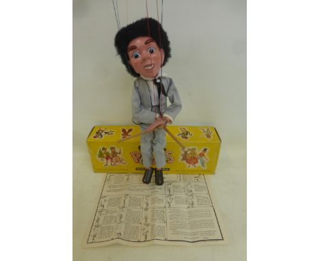 A boxed Pelham Puppet - Pop Singer as based on the Beatles, with grey suit outfit, depicting a drummer, original tissue paper