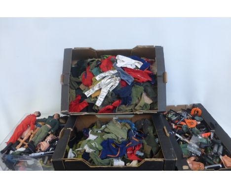 Four boxes of Action Man figures, accessories and clothing.