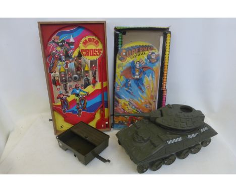A Superman bagatelle, a Moto Cross bagatelle by ArcoFalc and an Action Man plastic tank and trailer.