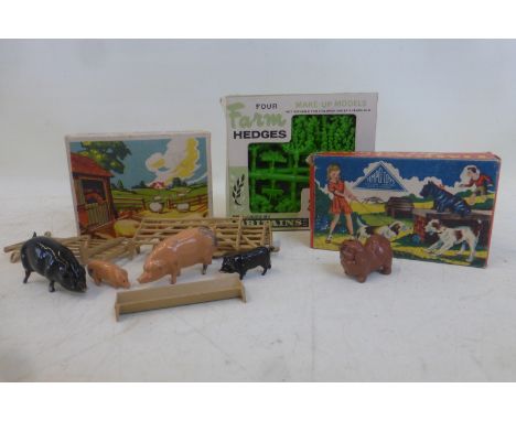 A boxed Britains Limited set of four farm hedges, catalogue no. 1730, a boxed Britain set of farm animals including piglets, 