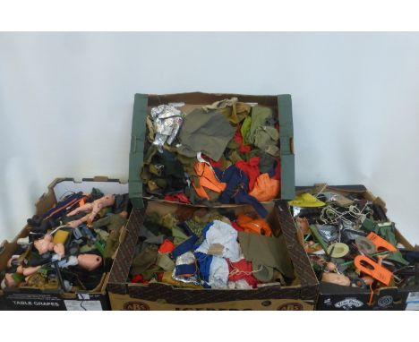 Four boxes of Action Man figures, accessories and clothing.