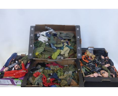 Four boxes of Action Man figures, accessories and clothing.