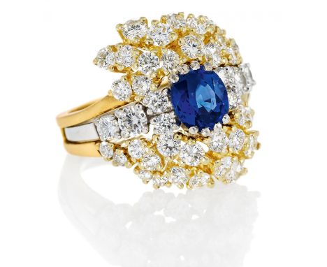 SAPPHIRE-DIAMOND-RING. Germany, ca. 1990. 750/- yellow-/white gold, total weight: 12.5g. EU-RM: 57. 44 brilliants in total ca