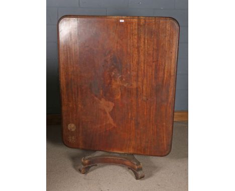 Victorian mahogany breakfast table, the rectangular tilt top with rounded corners raised on a cylindrical stem and quardruple