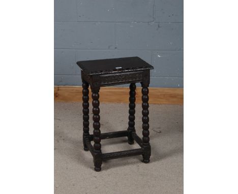 17th century style oak joint stool, the top above a carved frieze, raised on bobbin turned legs united by stretchers, 42cm wi