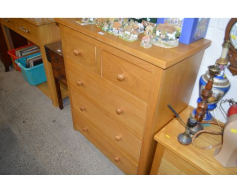 A light oak chest fitted two short over three long drawers 