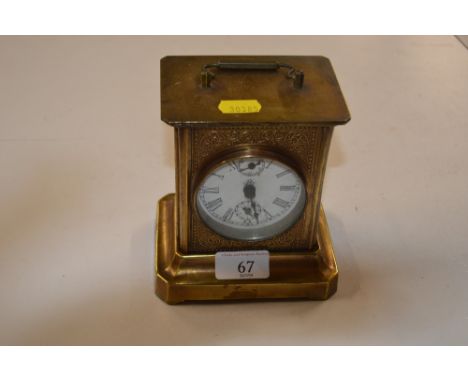 A brass cased mantel clock  AF