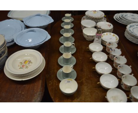 Seven Wedgwood green glazed coffee cans and saucers and matching sugar bowl