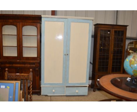 A painted pine two door cupboard fitted two drawers below 