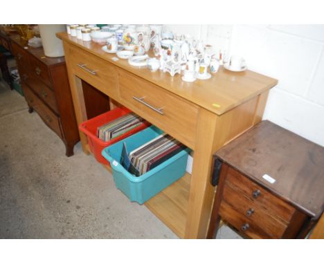 A light oak two tier side table fitted two drawers 