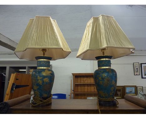 A reproduction desk lamp, a pair of brass lamps, a pair of aesthetic style lamps and a sun dial