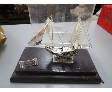 A white metal model of a ship named Santa Maria, stamped 950