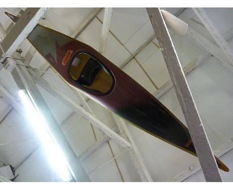 A K1 Salome canoe with paddle, spray deck, waterproof clothing and helmet