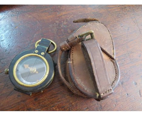 A WW2 leather cased brass compass