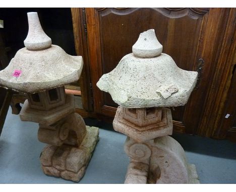 A pair of Japanese style composition stone garden lanterns on pedestal bases A/F