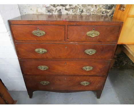 A George III mahogany inlaid chest of two short and three long drawers on bracket feet