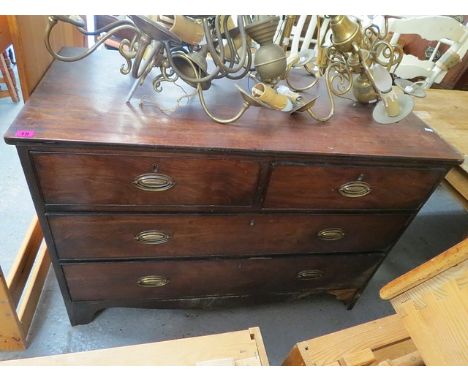 A George III mahogany chest of two short and two long drawers on bracket feet