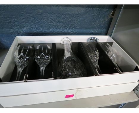 A boxed set of Royal Doulton glassware to include a decanter and four wine glasses