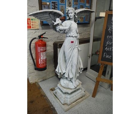 A stone and composition resin garden statue of an angel