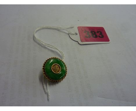 A Chinese 18k yellow gold and mottled green jade circular brooch, with calligraphy symbol to the centre, marked 18k and CS to