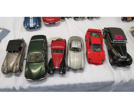 Six Franklin Mint die cast model cars to include a 1949 Jaguar XK120, 1939 Maybach and others