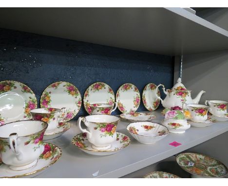 A Crown Derby Old Country Roses pattern part six setting tea service and two other Old Country Roses pieces