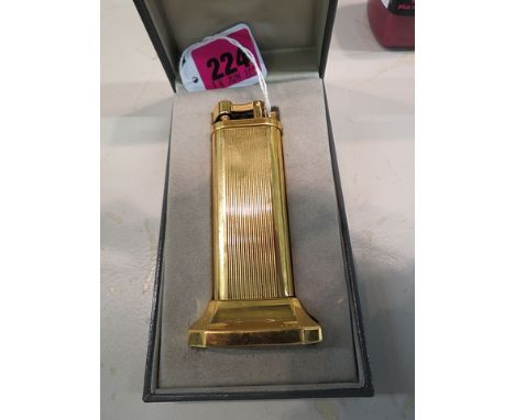 Dunhill - a brass cased table lighter. Serial number 10710