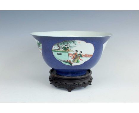 A large Chinese powder-blue ground bowl, in Kangxi style but late 19th century. The exterior delicately painted with figural 