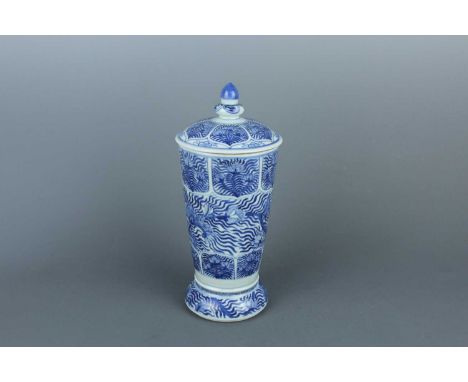 A blue and white goblet with cover, in Kangxi style but possibly a 19th-century Japanese copy. Of elongated form, the body ri
