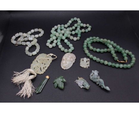 A group of ten Chinese jade ornaments, Qing Dynasty and later, comprising three jadeite necklaces, three white or pale celado