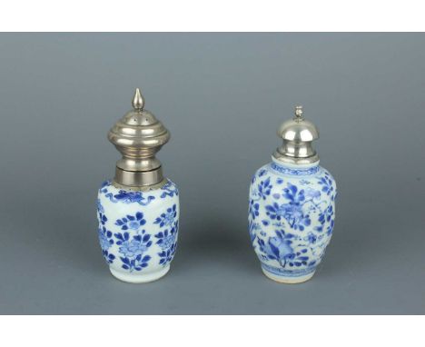 Two small Chinese blue and white ‘flowers’ bottle vases, Qing Dynasty, Kangxi period (1662–1722)  One vase is moulded with sp