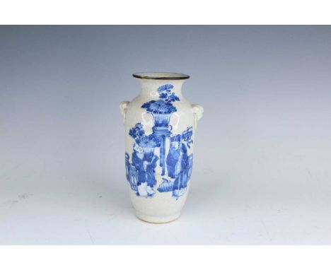A Chinese crackled-glaze blue and white vase, Qing Dynasty, late 19th century. A lantern-shaped porcelain vase with a crackle