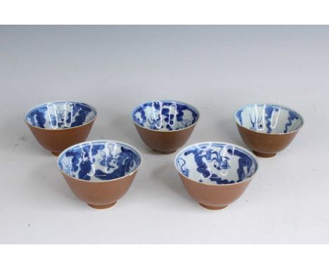Five Chinese brown-glazed and underglaze blue ‘goldfish’ bowls, Qing Dynasty, 19th century. Each with a brown-glazed exterior