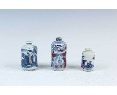 Three Chinese underglaze blue and red snuff bottles, Qing Dynasty, 19th century. The left bottle depicting the famous story S