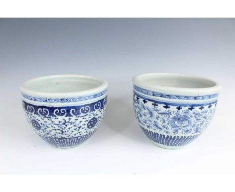 Two Chinese blue and white scroll bowls, Qing Dynasty, late 19th century. Each bowl is decorated with floral and foliage moti