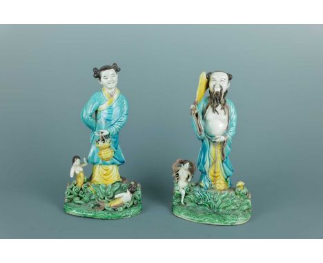 A pair of Chinese ‘Eight Immortals’ porcelain figures, Qing Dynasty. Finely modelled with two deities of the Eight Immortals,
