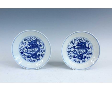 A pair of Chinese blue and white “dragon” dishes, Daoguang mark (1821-1850) and possibly of the period, each finely painted i