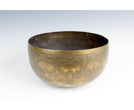 A Tibetan singing bowl, 19th/20th century, finely engraved with floral scrolls, celestial beings, and mythical animals, the b