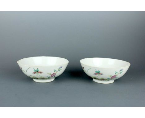A pair of Chinese famille rose ‘butterfly’ bowls, Qing Dynasty, Guangxu mark and of the period (1875-1908). Each with a subtl