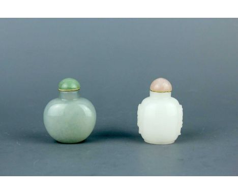 Two Chinese jade snuff bottles, Qing Dynasty, 19th century. Of ovoid forms, one with a celadon jade body topped with a green 