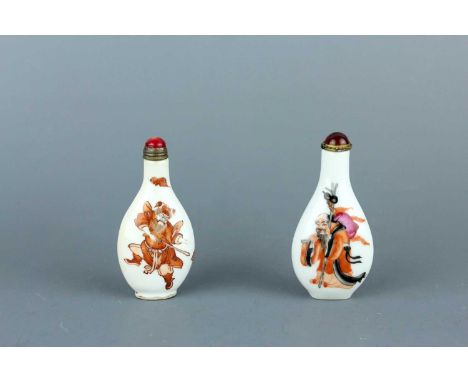 Two Chinese ‘figural’ porcelain snuff bottles, early 20th century. Each of flat pear-shaped form, one painted in iron-red wit