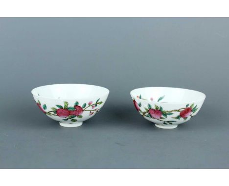 A pair of small Chinese egg-shell famille rose bowls, Guangxu mark but 20th century, finely painted with lychee fruit on tree