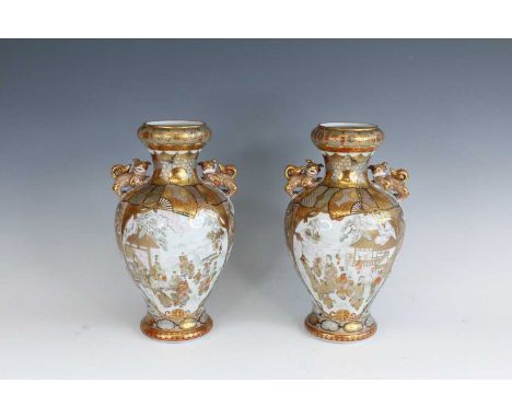 A pair of Japanese Kutani ‘figural’ vases, Meiji period, 19th or early 20th century. Each lavishly decorated with gilt and co