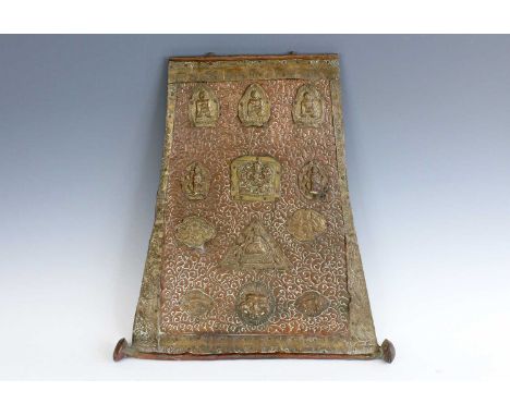 A Tibetan or Nepalese bronze Buddhist hanging panel, 18th to 19th century. A trapezoidal repoussé bronze panel with embellish