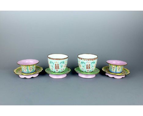 A set of four Chinese canton enamel cups and saucers, Qing Dynasty, 19th Century. Comprising a pair of green-ground cups and 