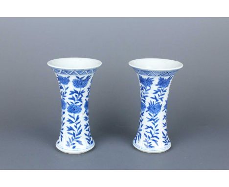 A pair of Chinese blue and white gu vases, Qing Dynasty, Kangxi period (1662–1722)  Each vase of slender gu form, painted in 