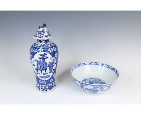 A Chinese blue and white vase and a bowl, Qing Dynasty, late 19th century. The vase of baluster form with a domed cover surmo