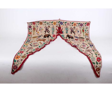 An antique/vintage Indian embroidered toran, 20th century, of Kutchi Rabari origin, finely hand-embroidered with vibrant depi