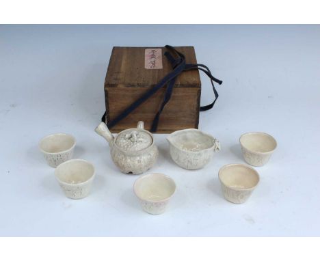A set of Japanese stoneware tea wares, in the taste of Ōtagaki Rengetsu (1791–1875), 19th or 20th century. Comprising a kyūsu